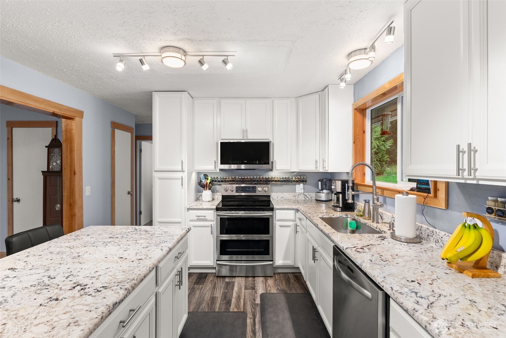 2434 Salzer Valley Road Centralia, WA 98531 - Photo 14 of 39 a kitchen with a stove a sink and a microwave