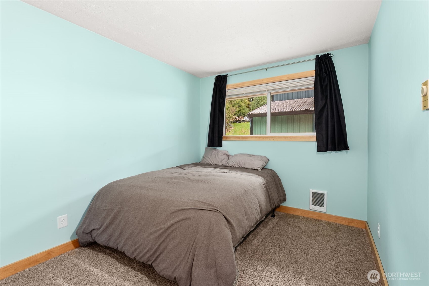 2434 Salzer Valley Road Centralia, WA 98531 - Photo 18 of 39 a bedroom with a bed and a window