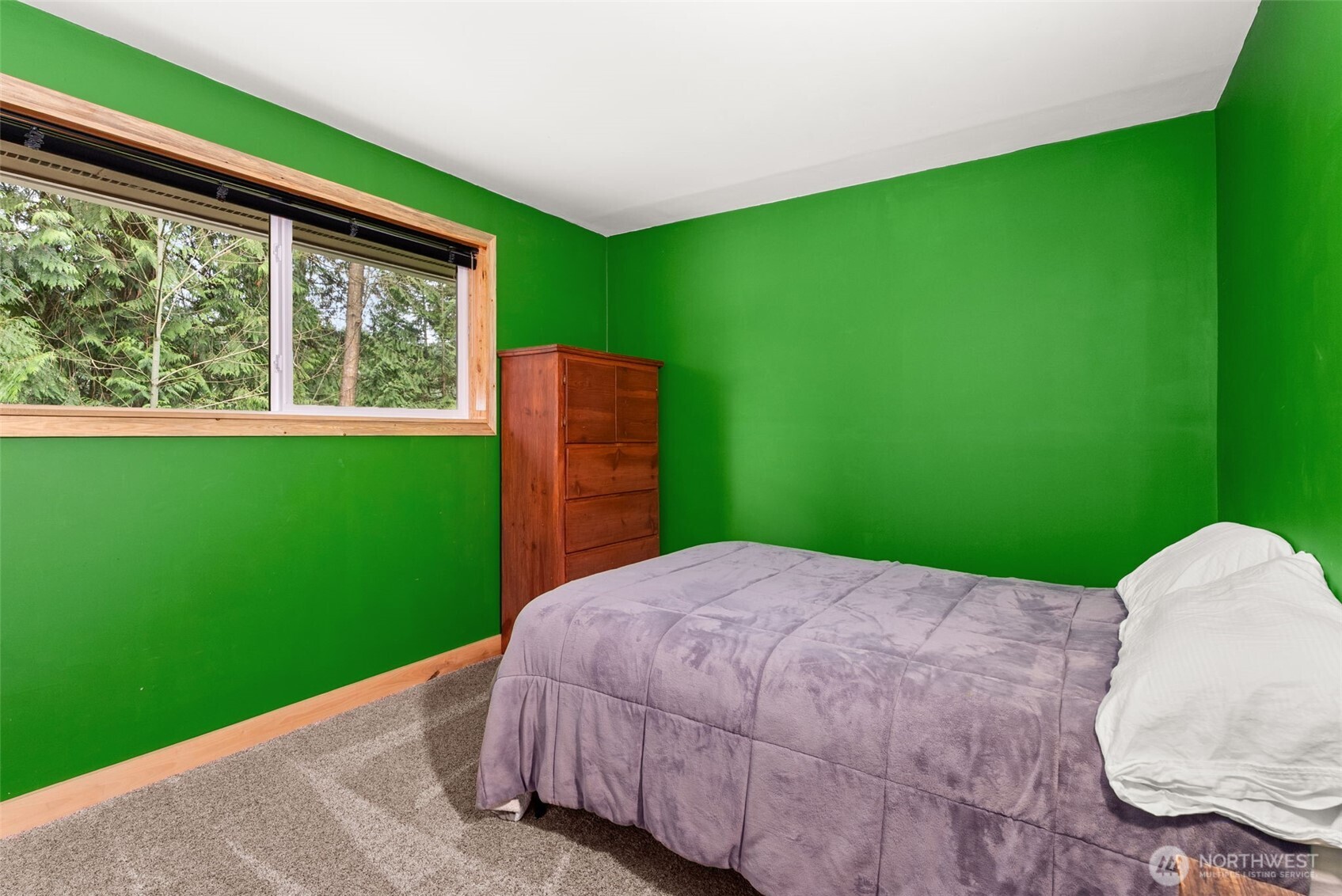 2434 Salzer Valley Road Centralia, WA 98531 - Photo 20 of 39 a bed sitting in a yard next to a window