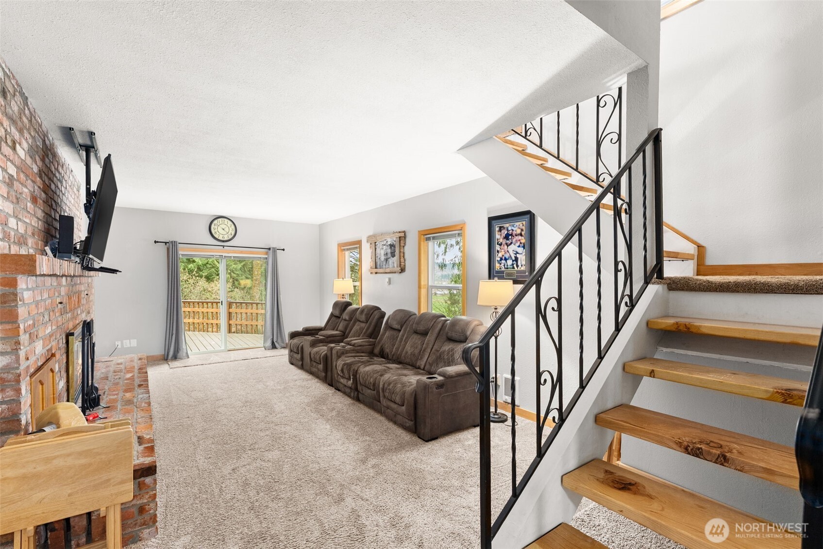 2434 Salzer Valley Road Centralia, WA 98531 - Photo 21 of 39 a living room with fireplace furniture and a flat screen tv