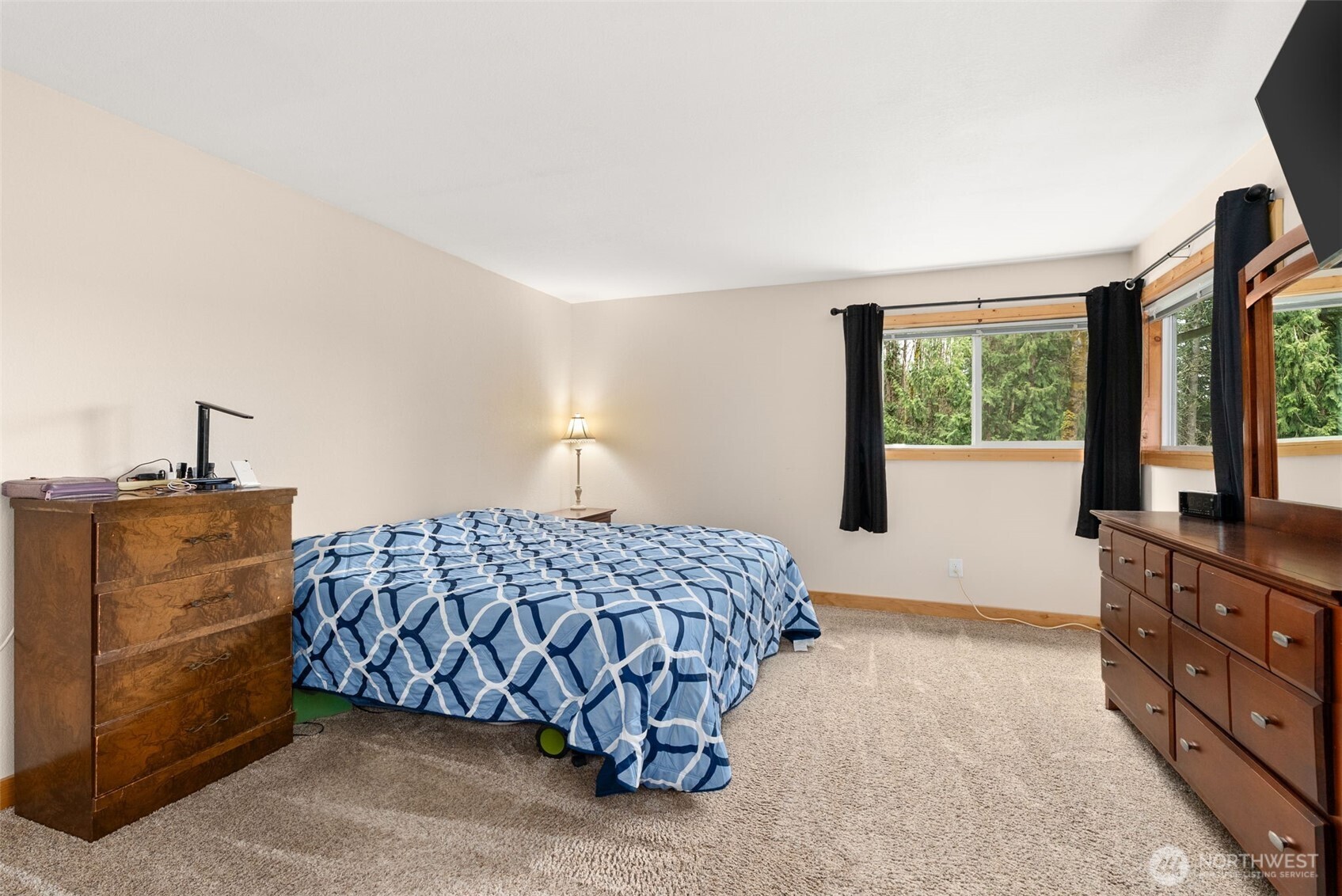 2434 Salzer Valley Road Centralia, WA 98531 - Photo 22 of 39 a bedroom with a bed and a dresser next to a window