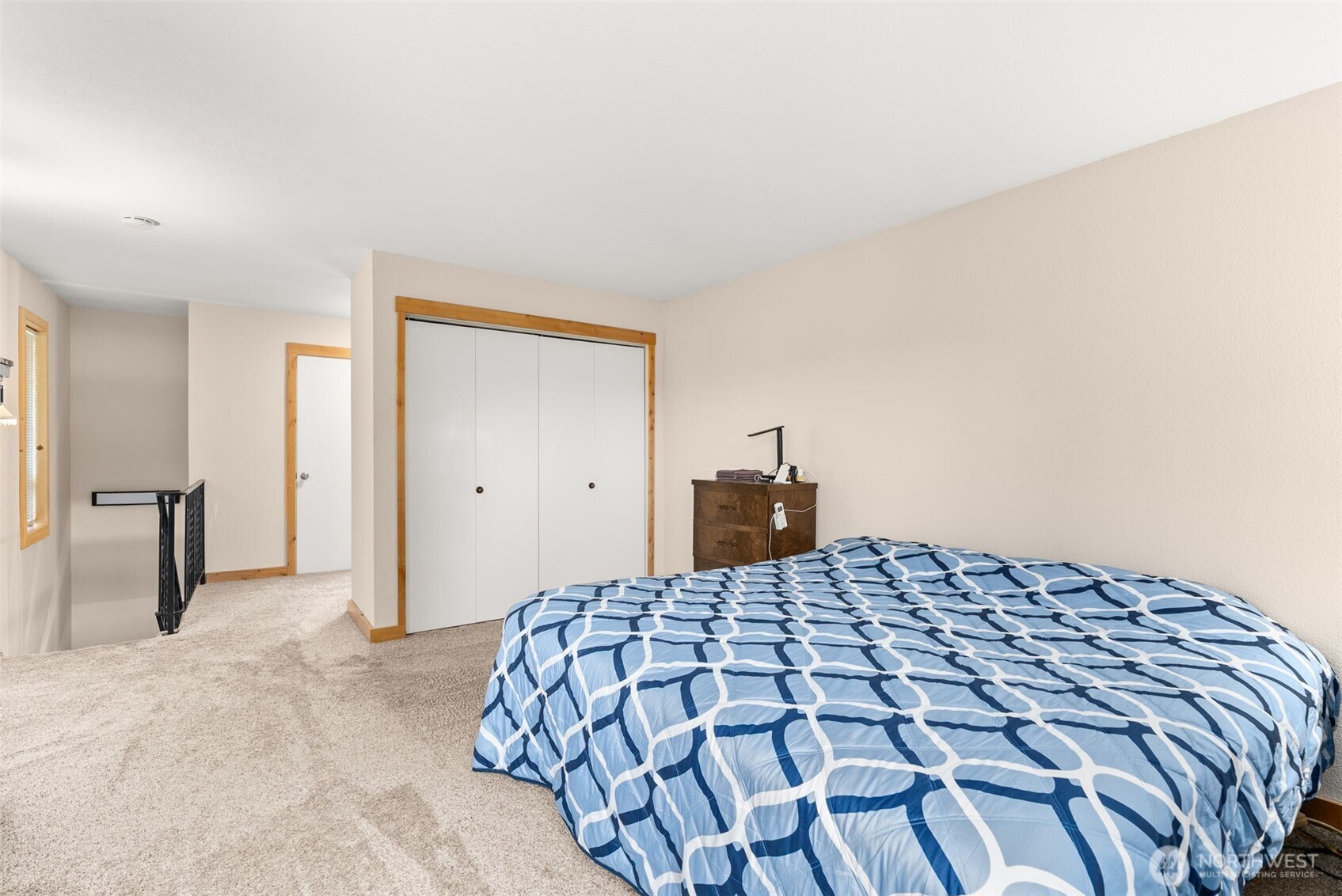 2434 Salzer Valley Road Centralia, WA 98531 - Photo 23 of 39 a bedroom with a large bed and a chandelier