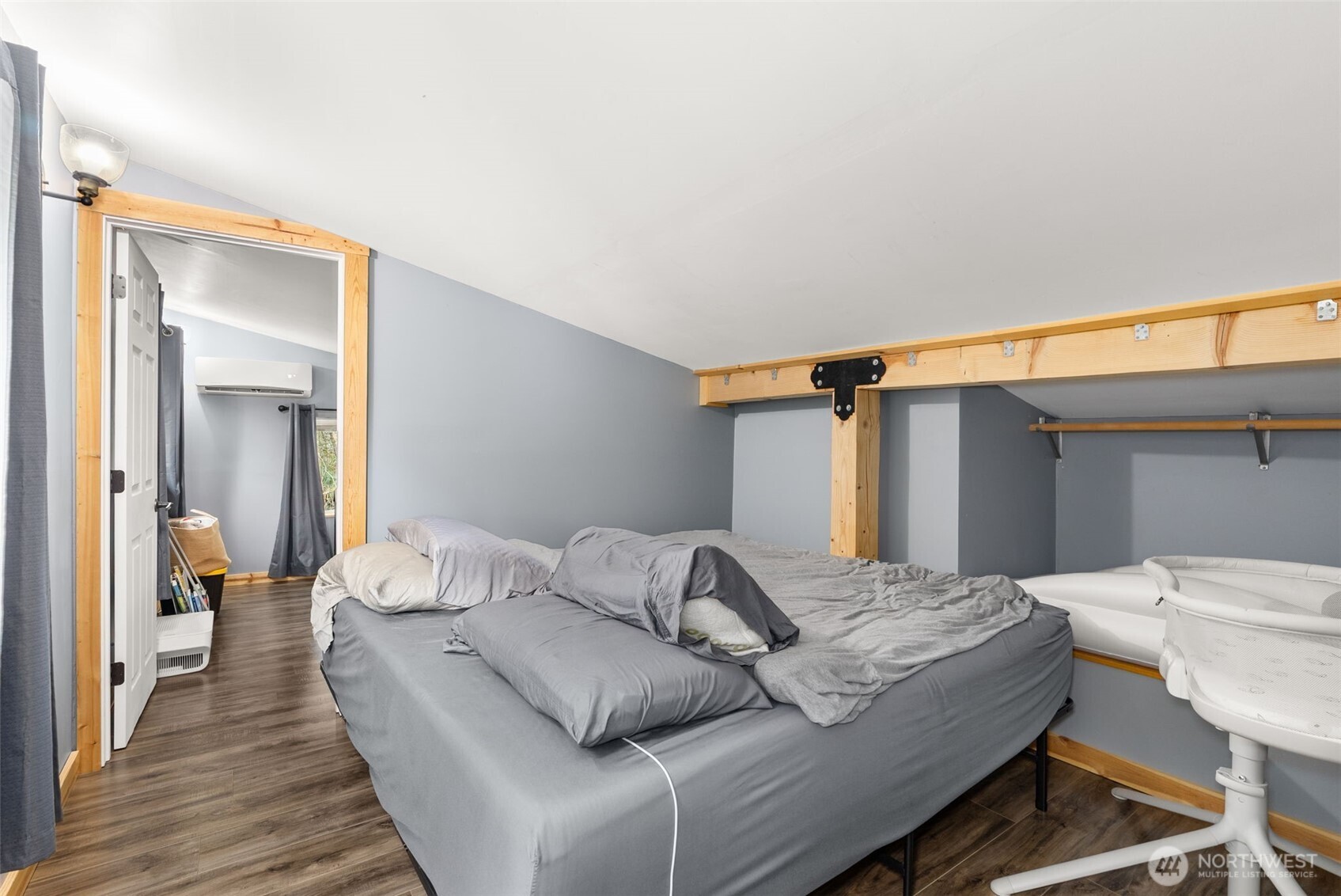 2434 Salzer Valley Road Centralia, WA 98531 - Photo 33 of 39 a bedroom with a bed and wooden floor