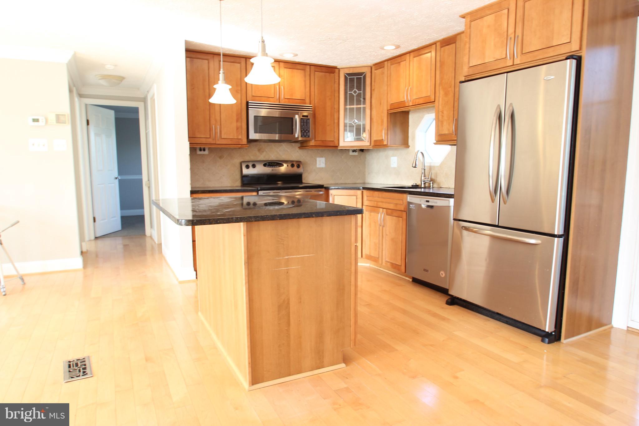 10 Box Circle Baltimore, MD 21221 - Photo 3 of 27 Kitchen with pendent and under cabinet lighting.