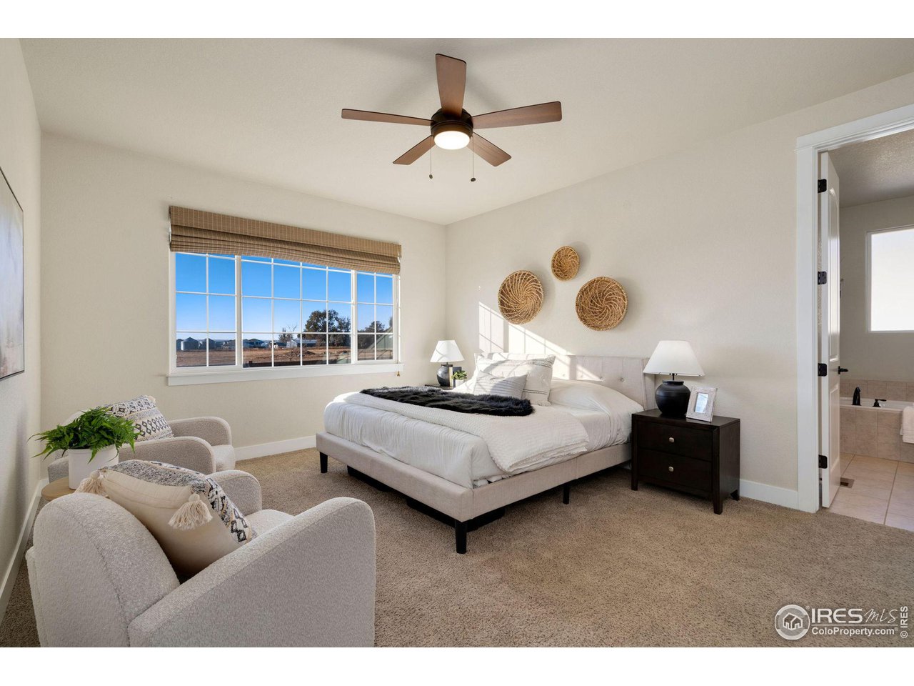 985 Mount Andrew Drive Severance, CO 80550 - Photo 16 of 25 a living room with furniture kitchen view and a chandelier