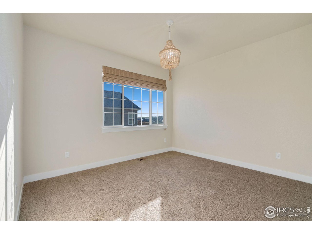 985 Mount Andrew Drive Severance, CO 80550 - Photo 20 of 25 a view of an empty room with a window