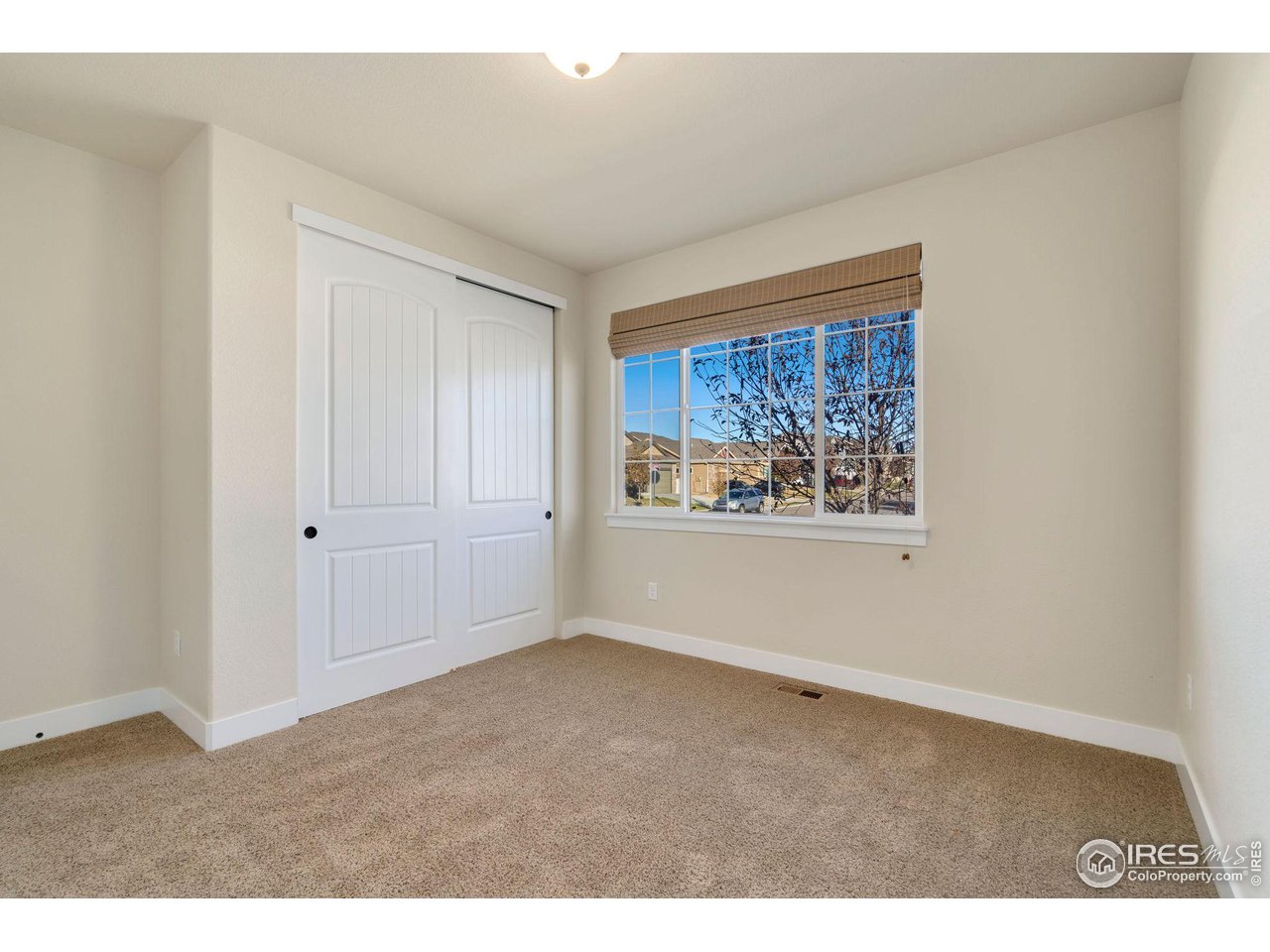 985 Mount Andrew Drive Severance, CO 80550 - Photo 22 of 25 a view of an empty room with a window