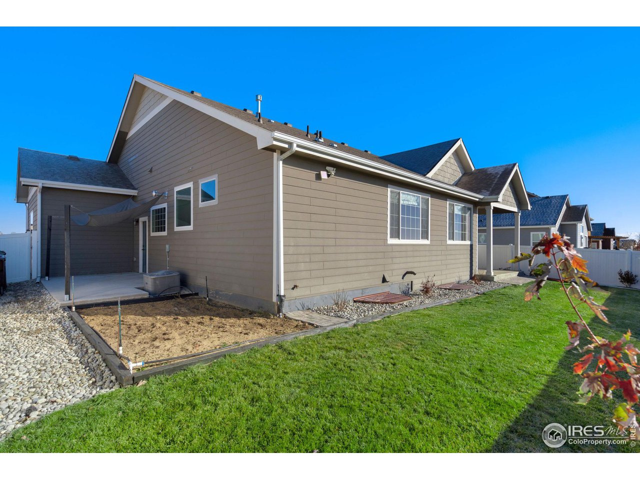 985 Mount Andrew Drive Severance, CO 80550 - Photo 25 of 25 a backyard of a house with table and chairs