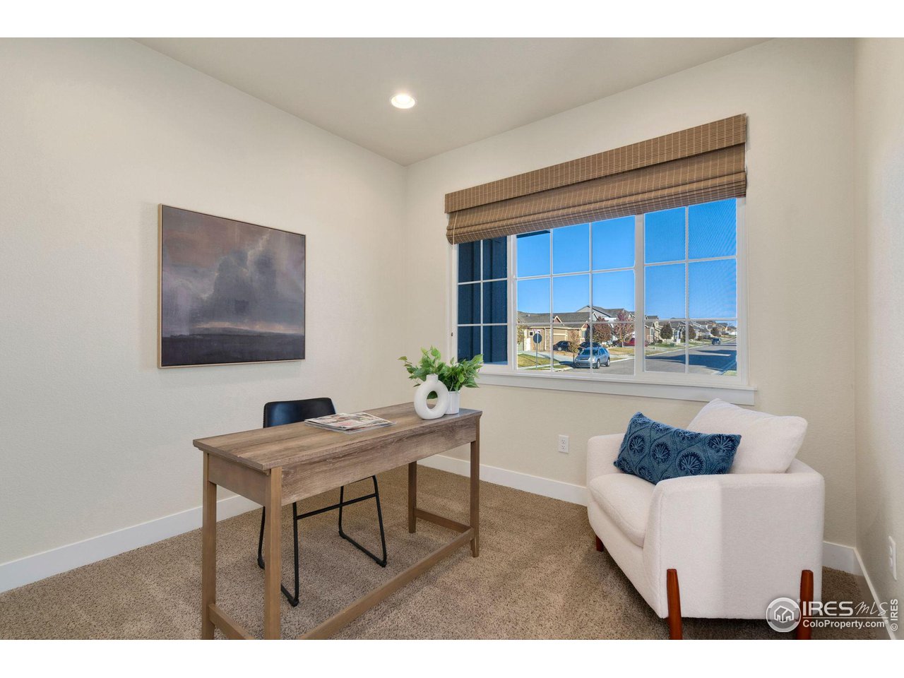 985 Mount Andrew Drive Severance, CO 80550 - Photo 5 of 25 a living room with white couches and a coffee table