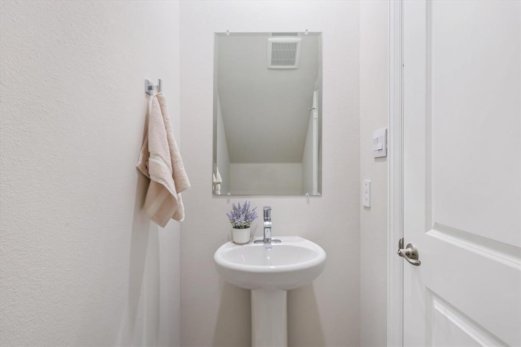 4518 Community Court Plano, TX 75024 - Photo 11 of 32 a bathroom with a sink a mirror and a shower
