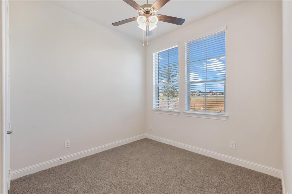 4518 Community Court Plano, TX 75024 - Photo 14 of 32 an empty room with a window and a fan