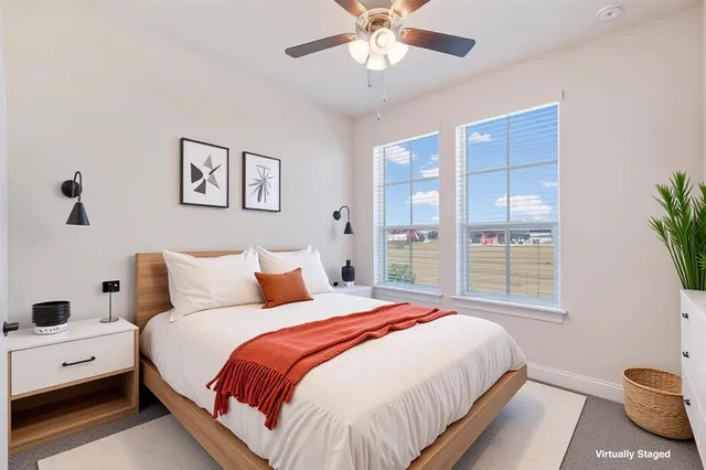 a bedroom with bed and window