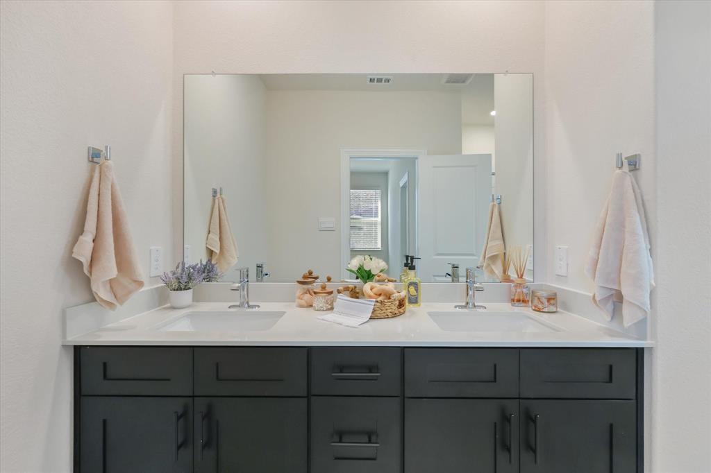 4518 Community Court Plano, TX 75024 - Photo 17 of 32 a bathroom with a sink and a mirror
