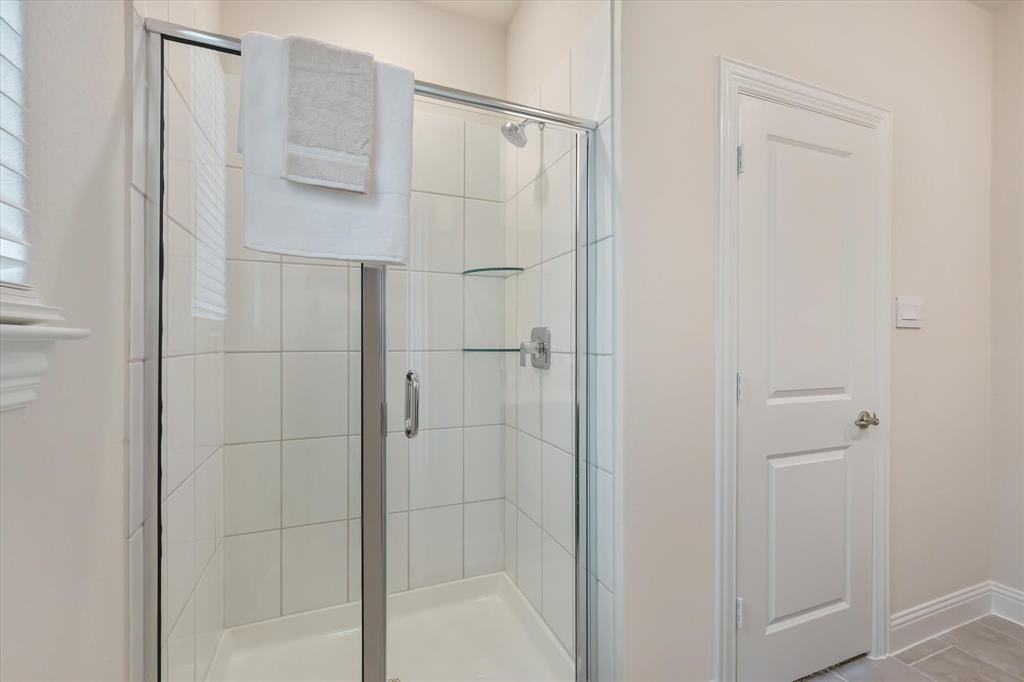 4518 Community Court Plano, TX 75024 - Photo 19 of 32 a bathroom with a shower