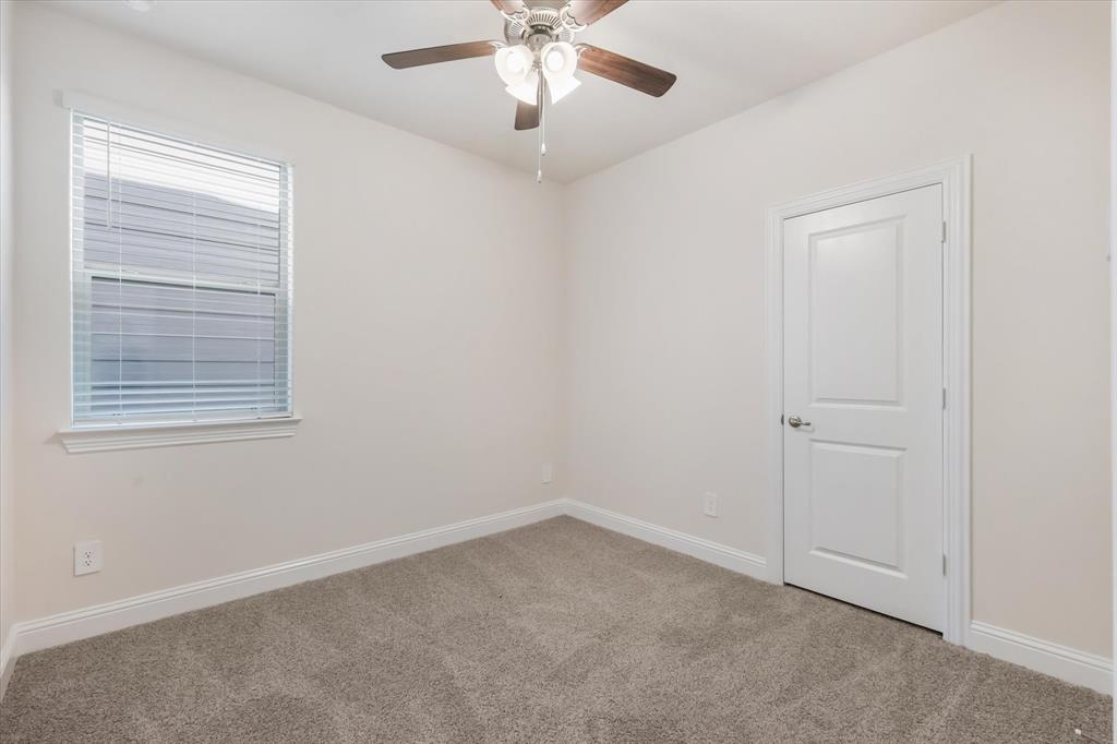 4518 Community Court Plano, TX 75024 - Photo 8 of 32 an empty room with windows and fan