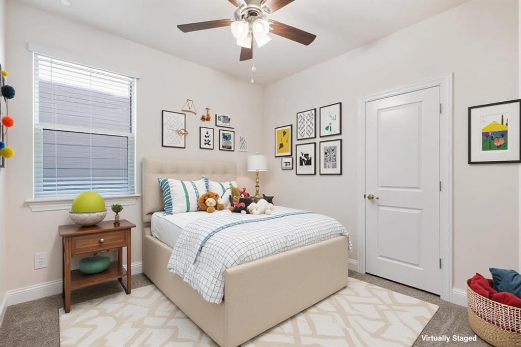 4518 Community Court Plano, TX 75024 - Photo 9 of 32 a bedroom with a bed and a chandelier