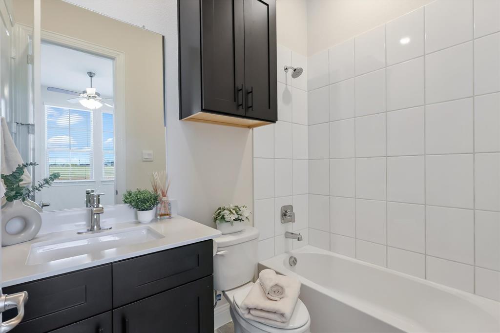4518 Community Court Plano, TX 75024 - Photo 10 of 32 a bathroom with a sink a toilet and bathtub