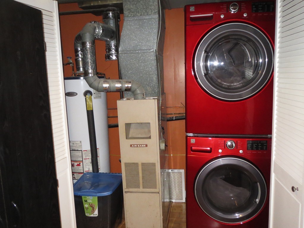 62 Cuff Avenue Springfield, MA 01104 - Photo 15 of 30 a view of a bedroom with washer and dryer