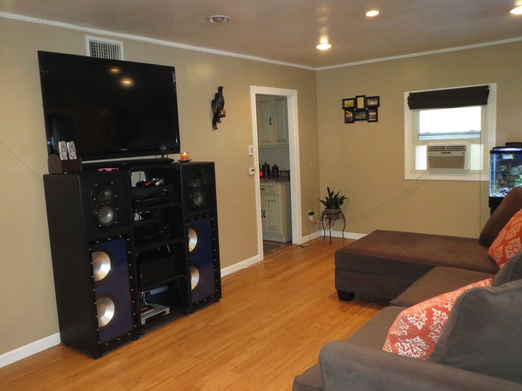 62 Cuff Avenue Springfield, MA 01104 - Photo 3 of 30 a living room with furniture and a flat screen tv