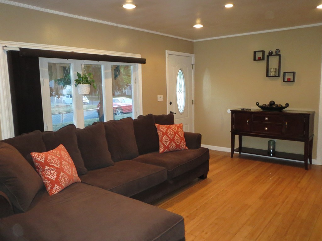 62 Cuff Avenue Springfield, MA 01104 - Photo 4 of 30 a living room with furniture and a dresser