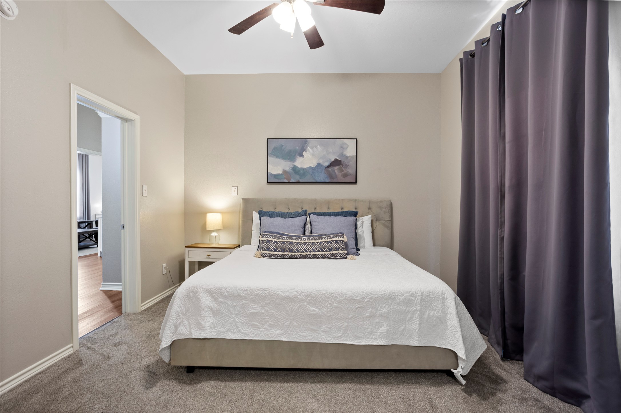 427 West 1st Street Freeport, TX 77541 - Photo 10 of 21 a bedroom with a bed and a chandelier