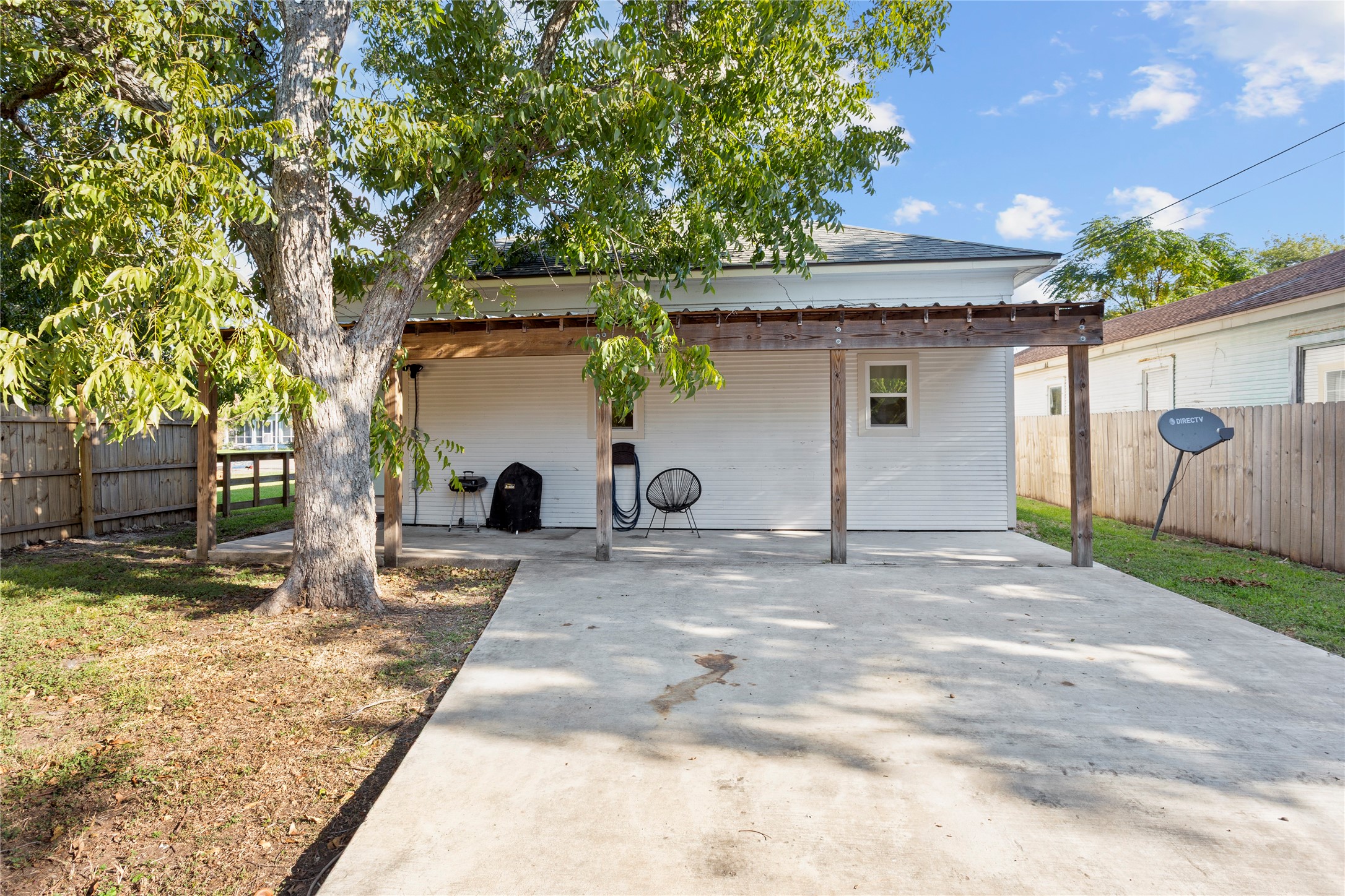 427 West 1st Street Freeport, TX 77541 - Photo 17 of 21 a view of a house with a yard and garage