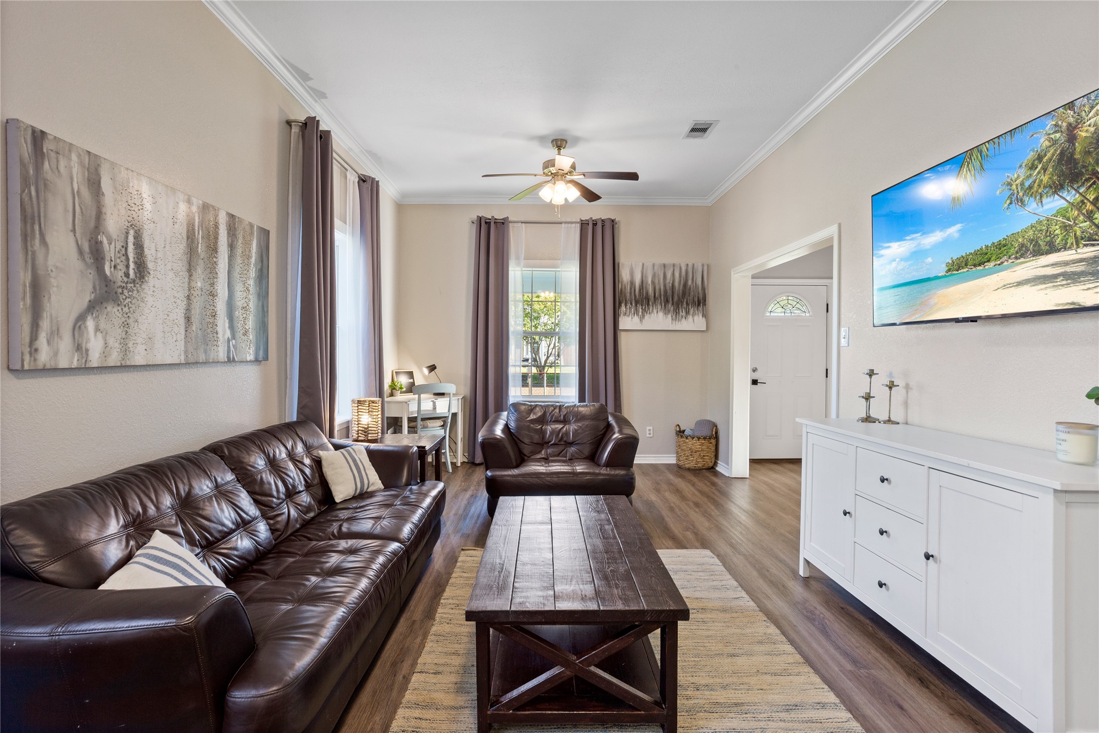 427 West 1st Street Freeport, TX 77541 - Photo 3 of 21 a living room with furniture and large windows