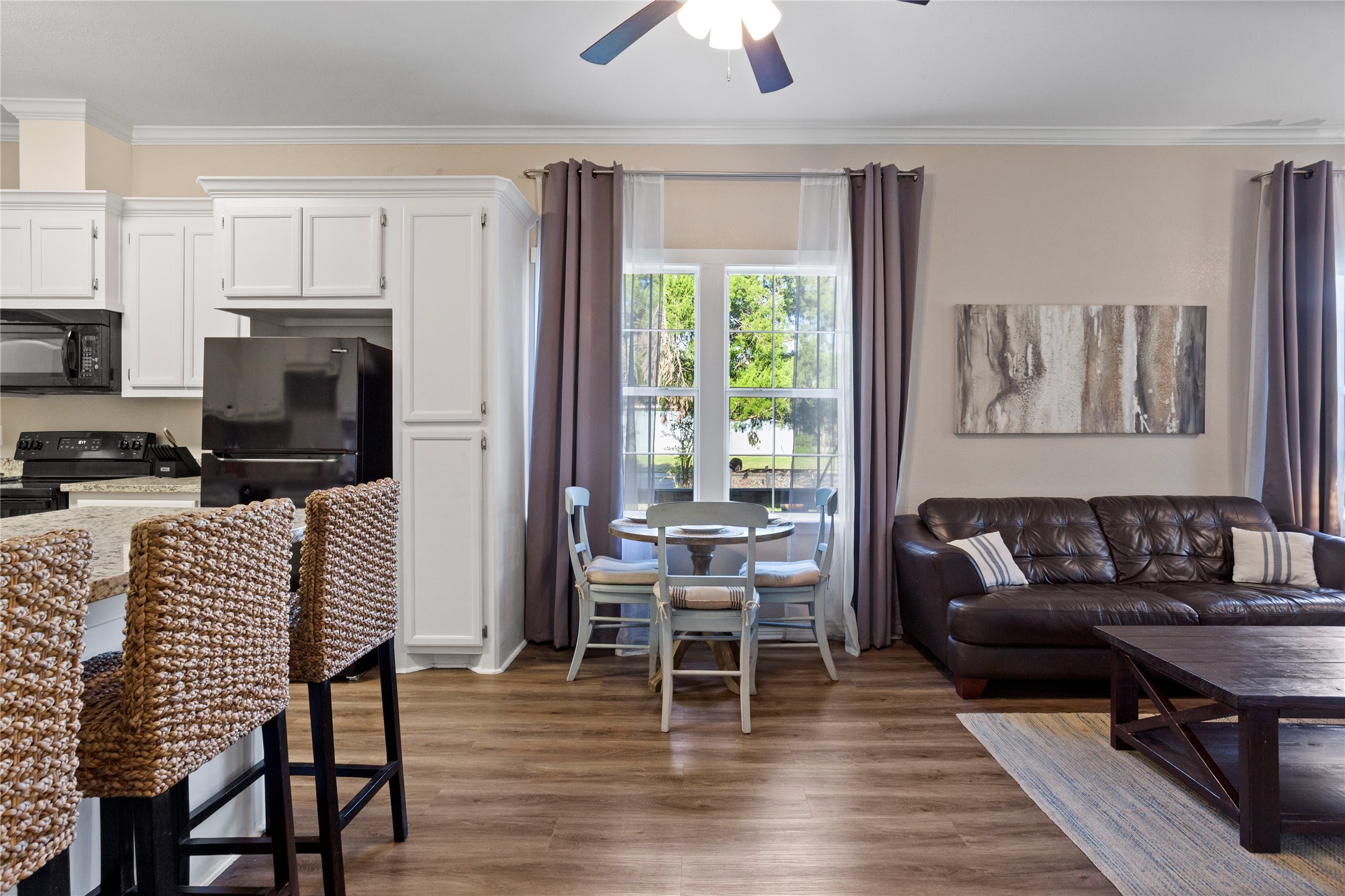 427 West 1st Street Freeport, TX 77541 - Photo 4 of 21 a living room with furniture a fireplace and a flat screen tv