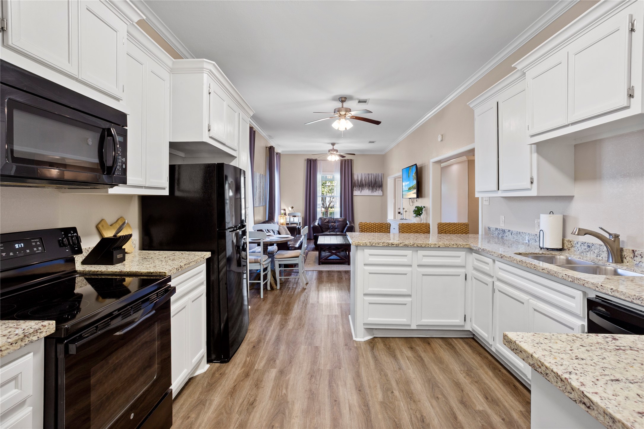 427 West 1st Street Freeport, TX 77541 - Photo 6 of 21 a kitchen with a sink stove and refrigerator