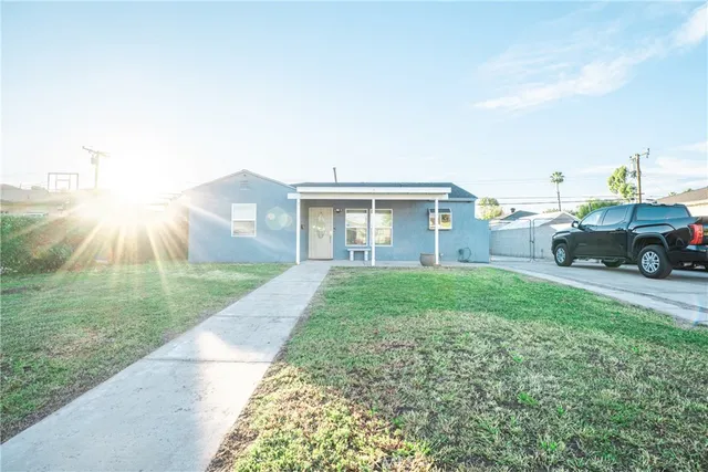 a view of a house with a back yard