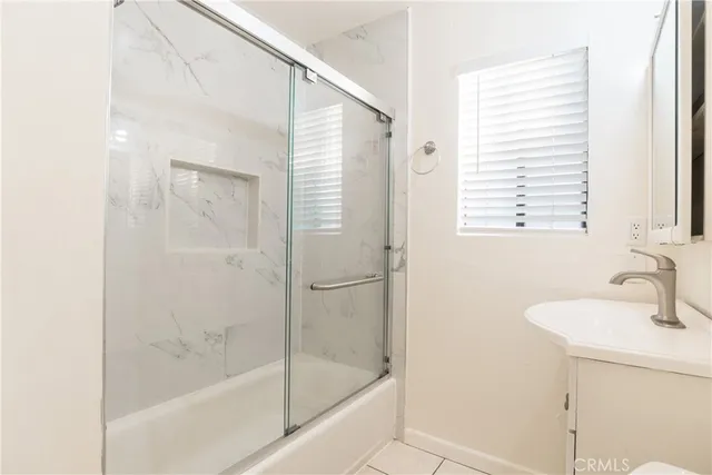 a bathroom with a bathtub and a sink