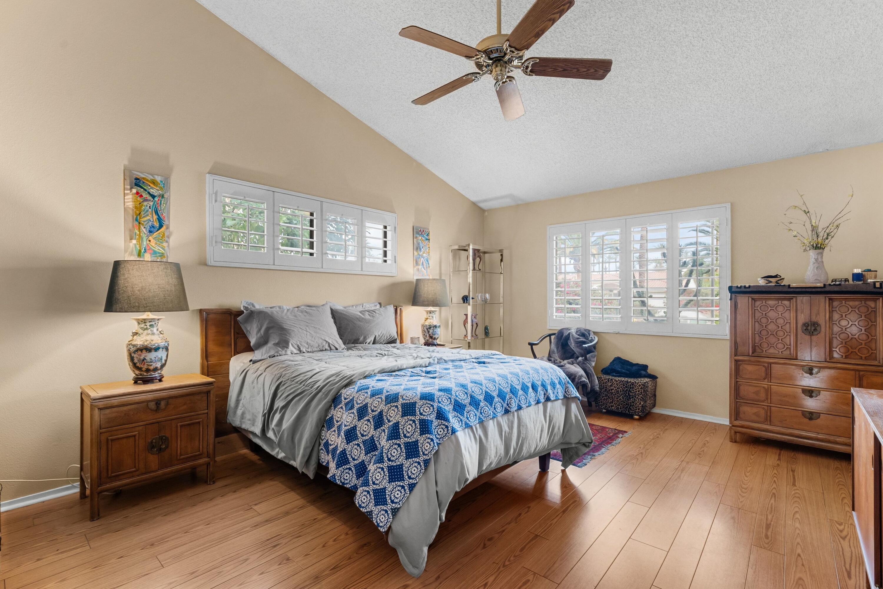 70451 Cobb Road Rancho Mirage, CA 92270 - Photo 12 of 13 a bedroom with a bed and a chandelier