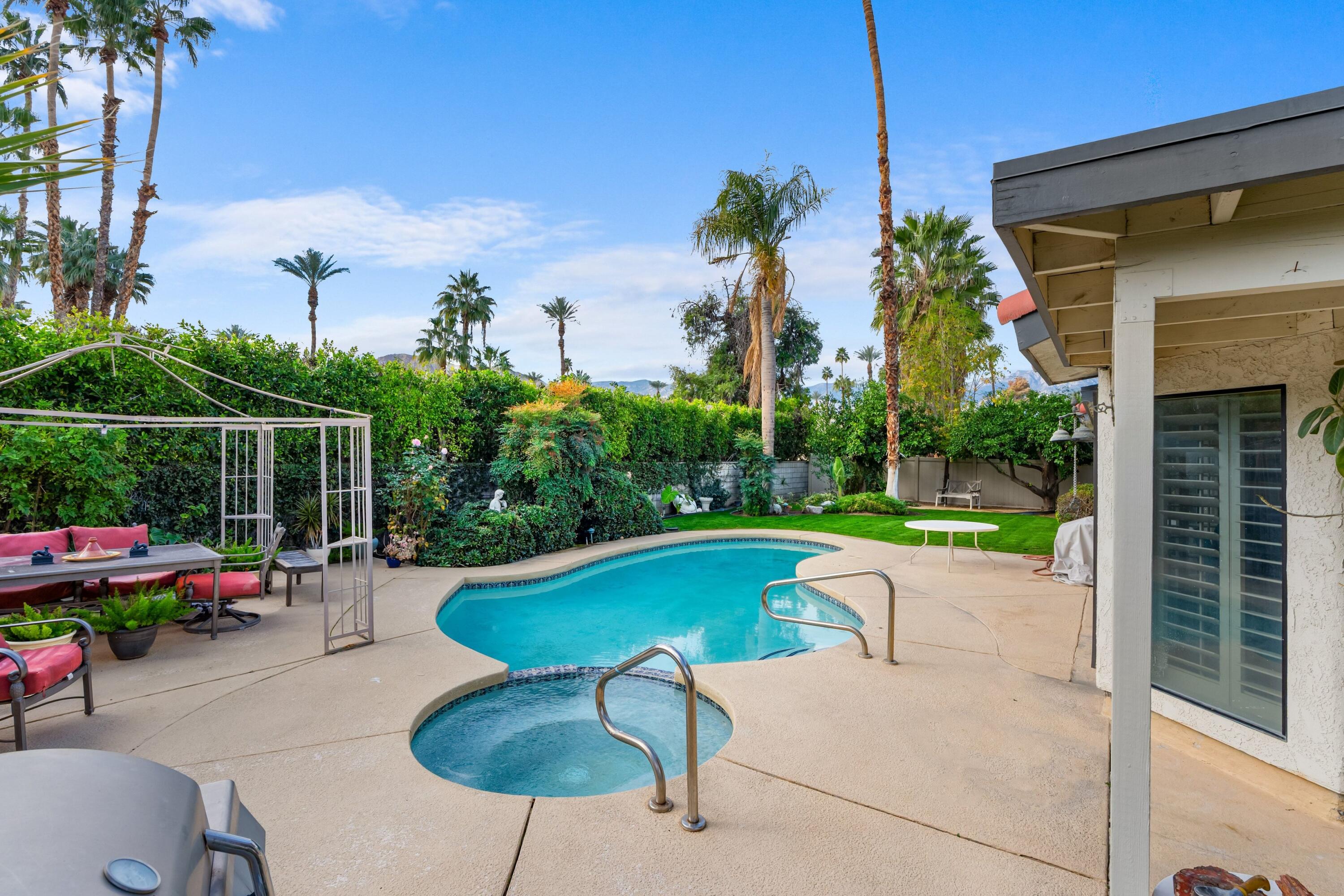 70451 Cobb Road Rancho Mirage, CA 92270 - Photo 4 of 13 a swimming pool with outdoor seating and yard