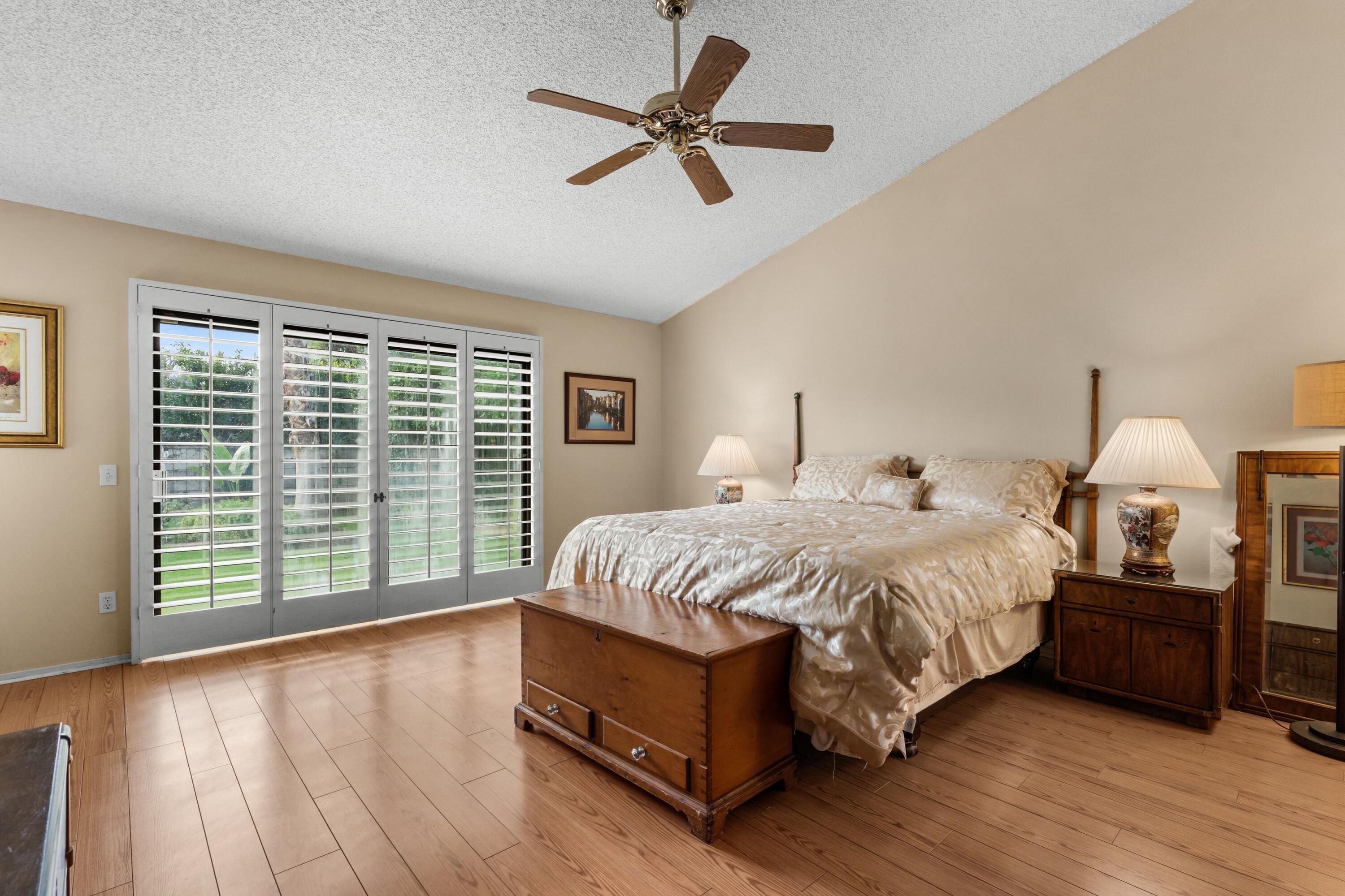 70451 Cobb Road Rancho Mirage, CA 92270 - Photo 5 of 13 a bedroom with a bed and a large window
