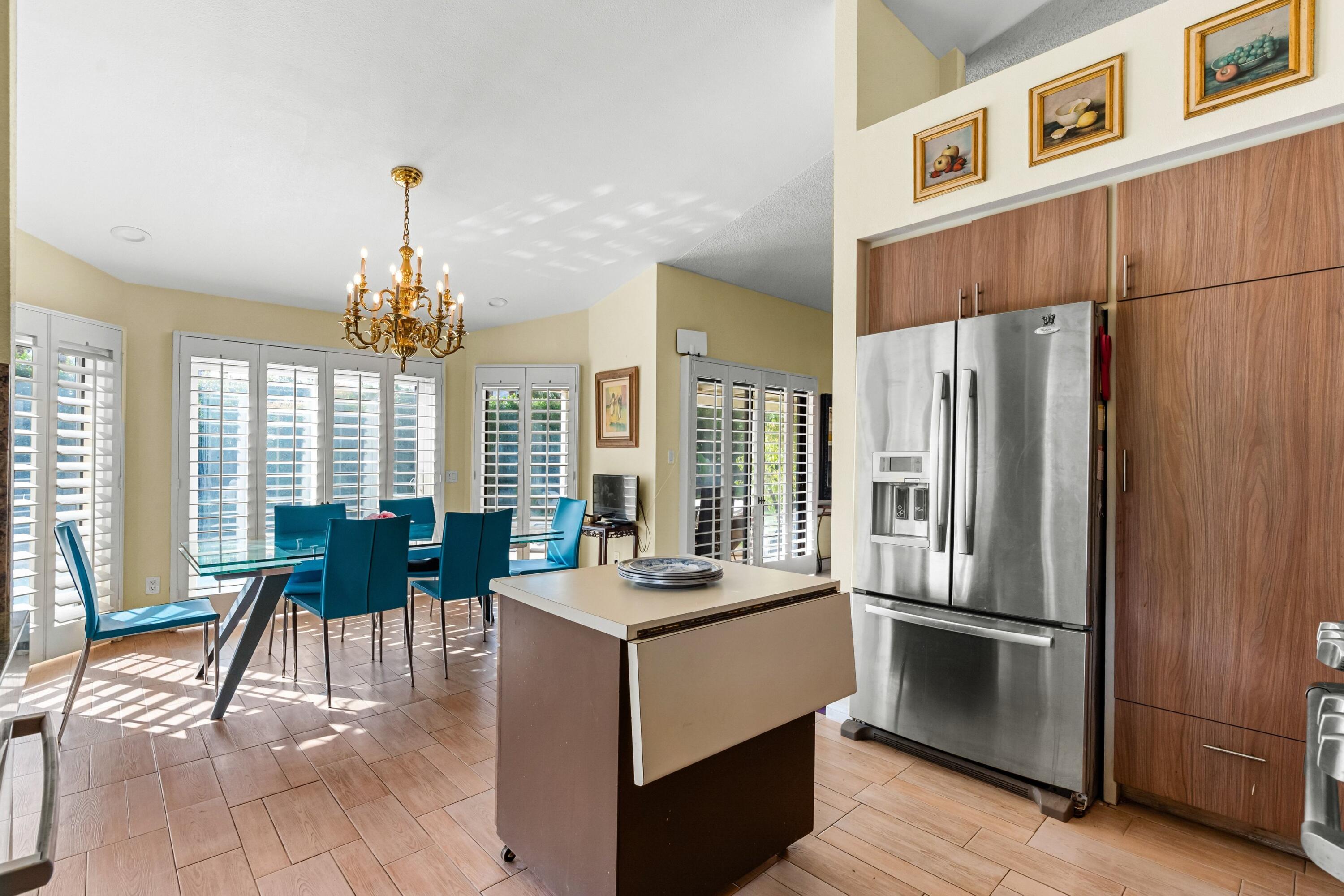 70451 Cobb Road Rancho Mirage, CA 92270 - Photo 9 of 13 a kitchen with stainless steel appliances a refrigerator a stove a sink and dishwasher