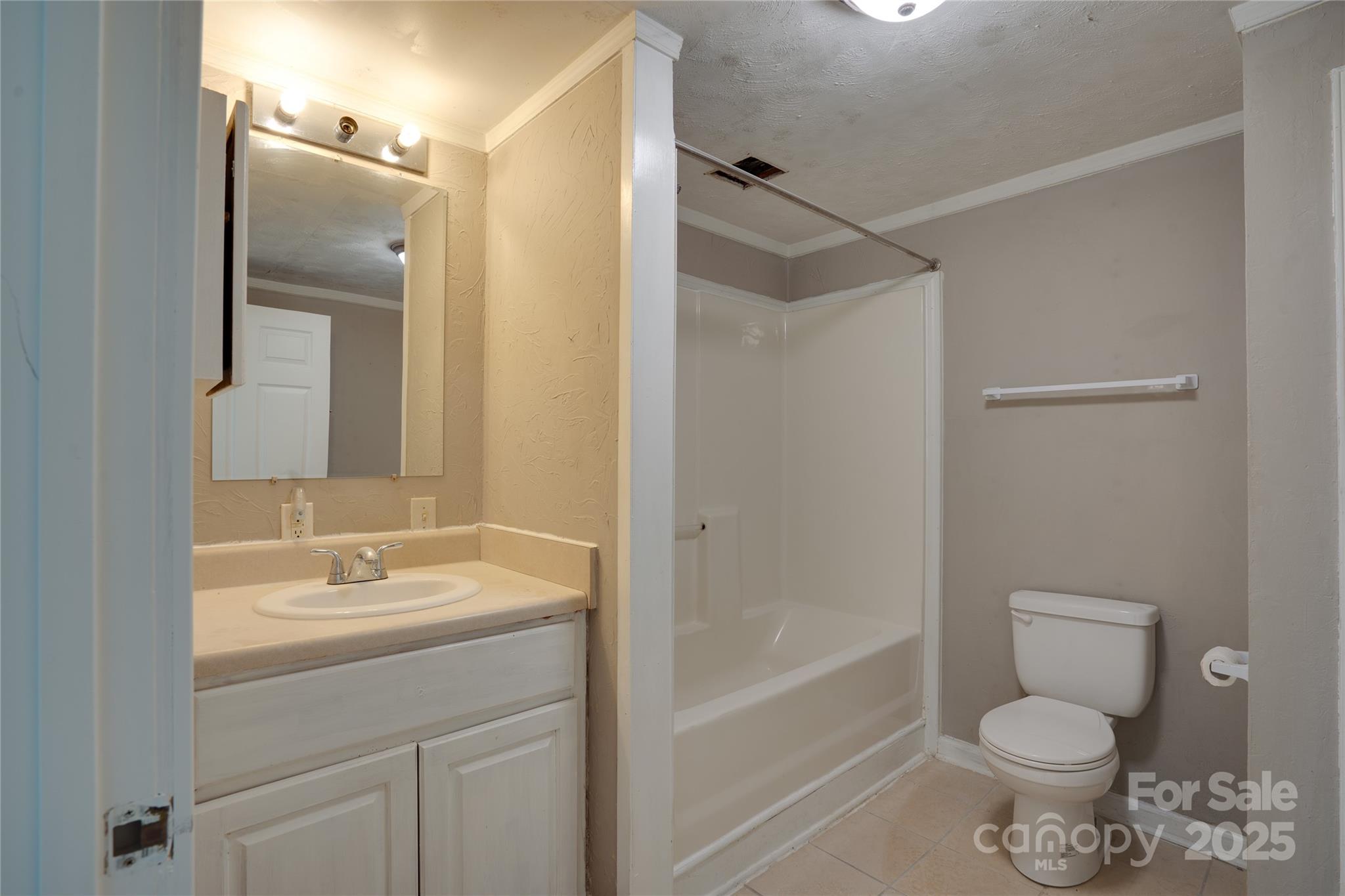 401 Little Street Lincolnton, NC 28092 - Photo 10 of 17 a bathroom with a sink toilet and shower