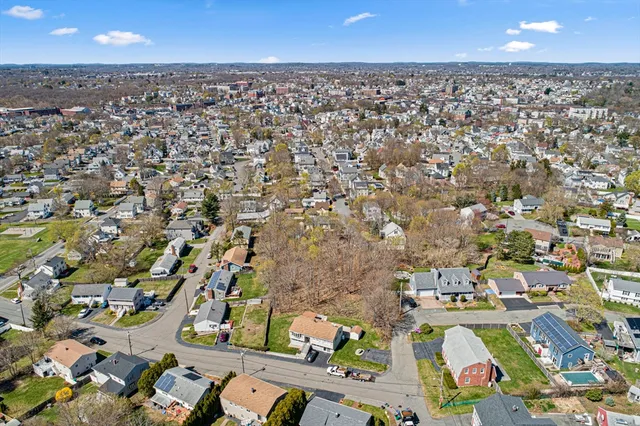 an aerial view of residential building with parking space