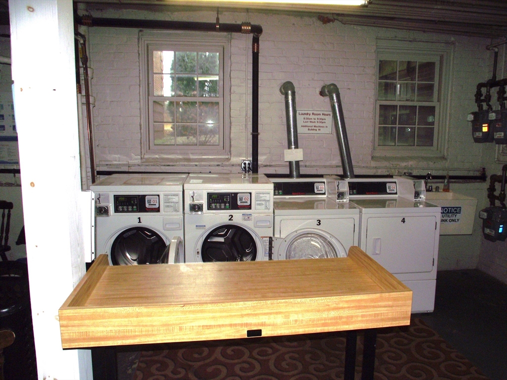 10 Presidents Lane, Unit 10 Quincy, MA 02169 - Photo 13 of 15 a view of table and chair
