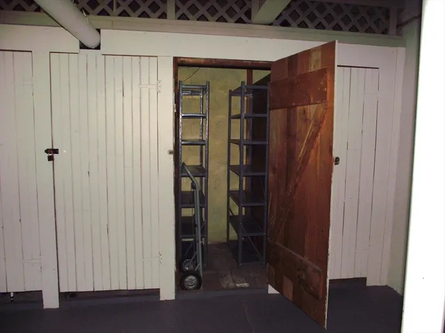 a view of a gallery with wooden floor