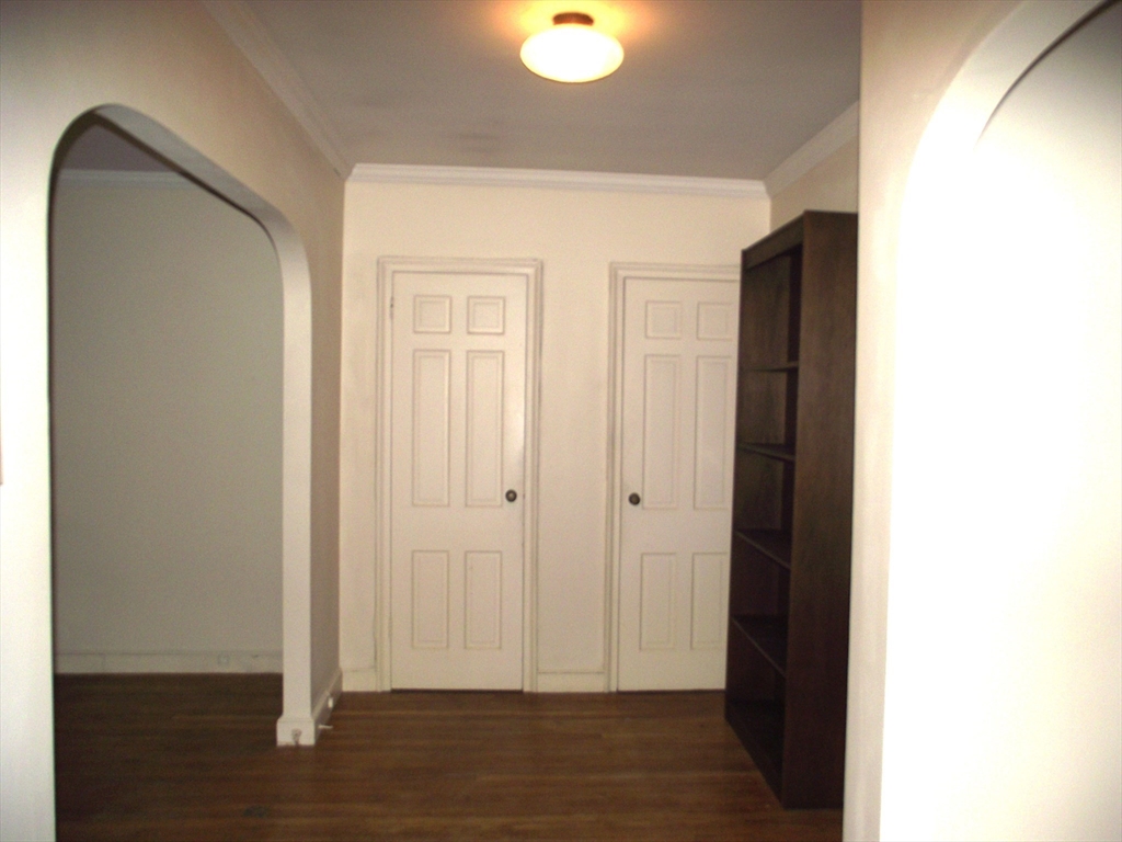 10 Presidents Lane, Unit 10 Quincy, MA 02169 - Photo 2 of 15 a view of a livingroom with wooden floor