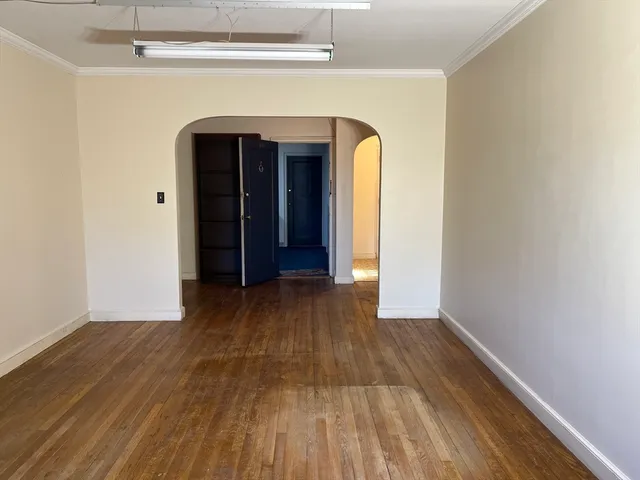 a view of front door with wooden floor