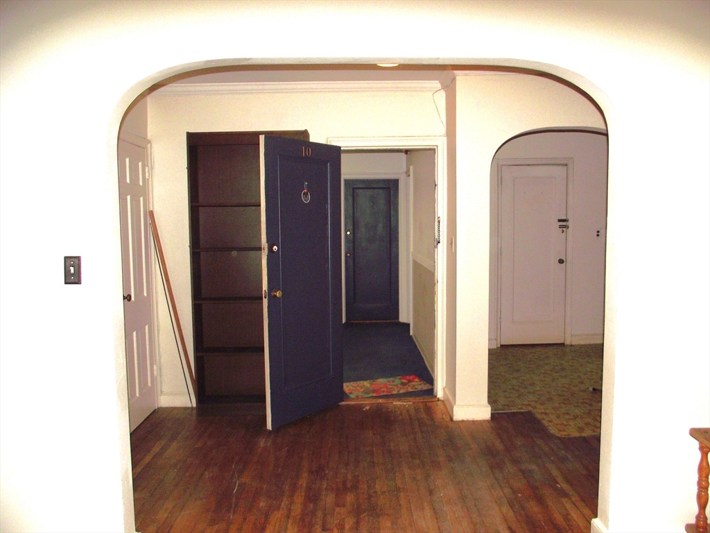 10 Presidents Lane, Unit 10 Quincy, MA 02169 - Photo 7 of 15 a view of front door with wooden floor