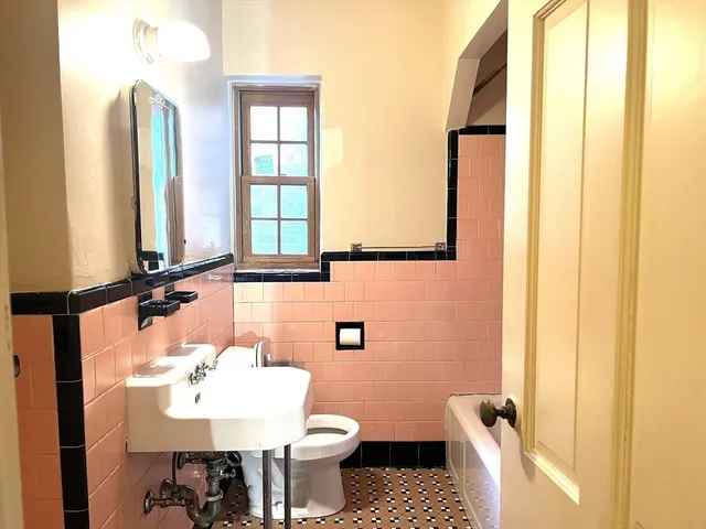 a bathroom with a bathtub and shower