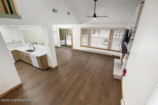 a living room with furniture and a window