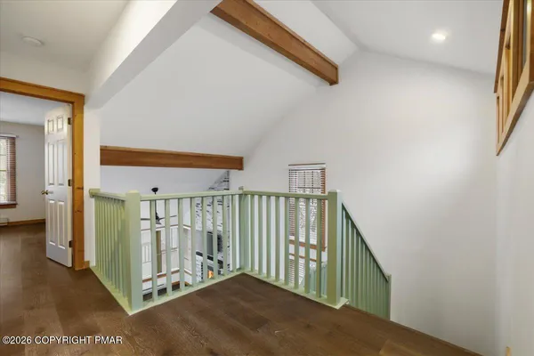 a view of a hallway with staircase