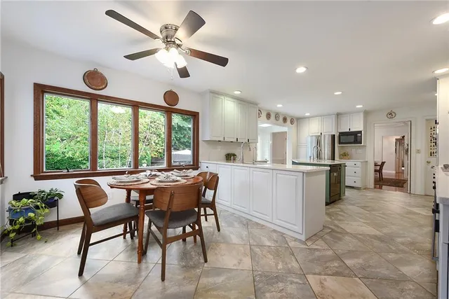 a view of a dining room with furniture window and outside view