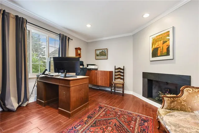 a view of kitchen with stainless steel appliances granite countertop a stove and a refrigerator