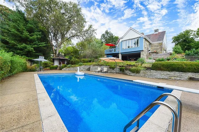 a chairs and table in front of a house