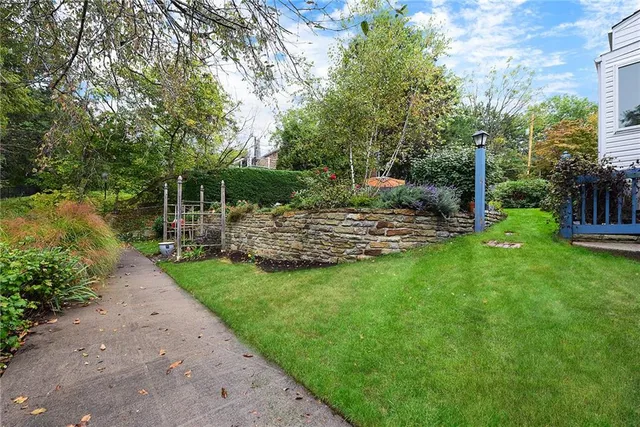 a view of balcony with furniture and umbrella
