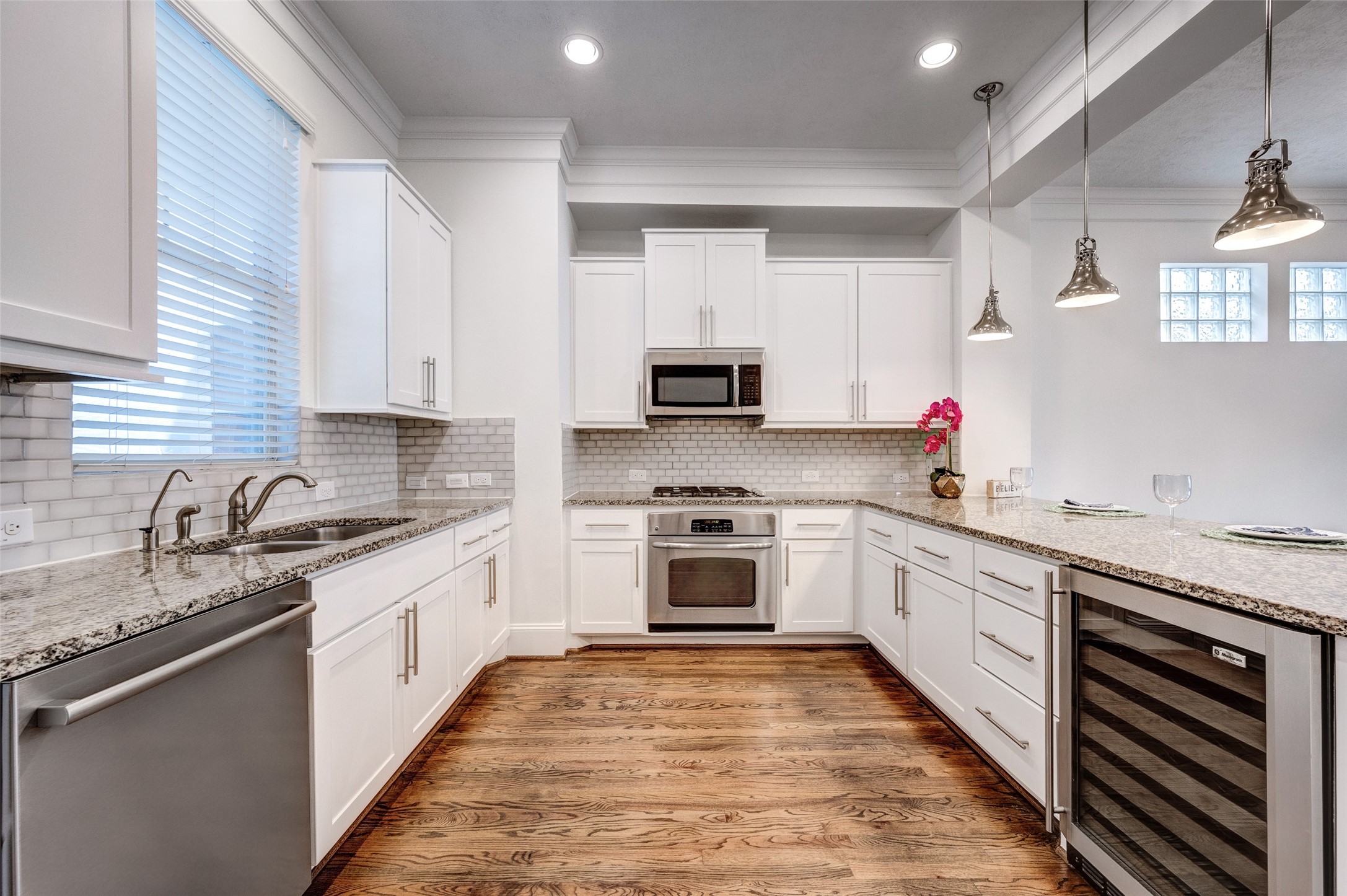 1413 Patterson Street Houston, TX 77007 - Photo 8 of 37 The kitchen includes stainless steel appliances such as gas stove and wine fridge